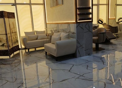 Luxurious lounge area at Velvet Glow Ladies Salon, Dubai, Dubai, AE, with modern seating and warm lighting.