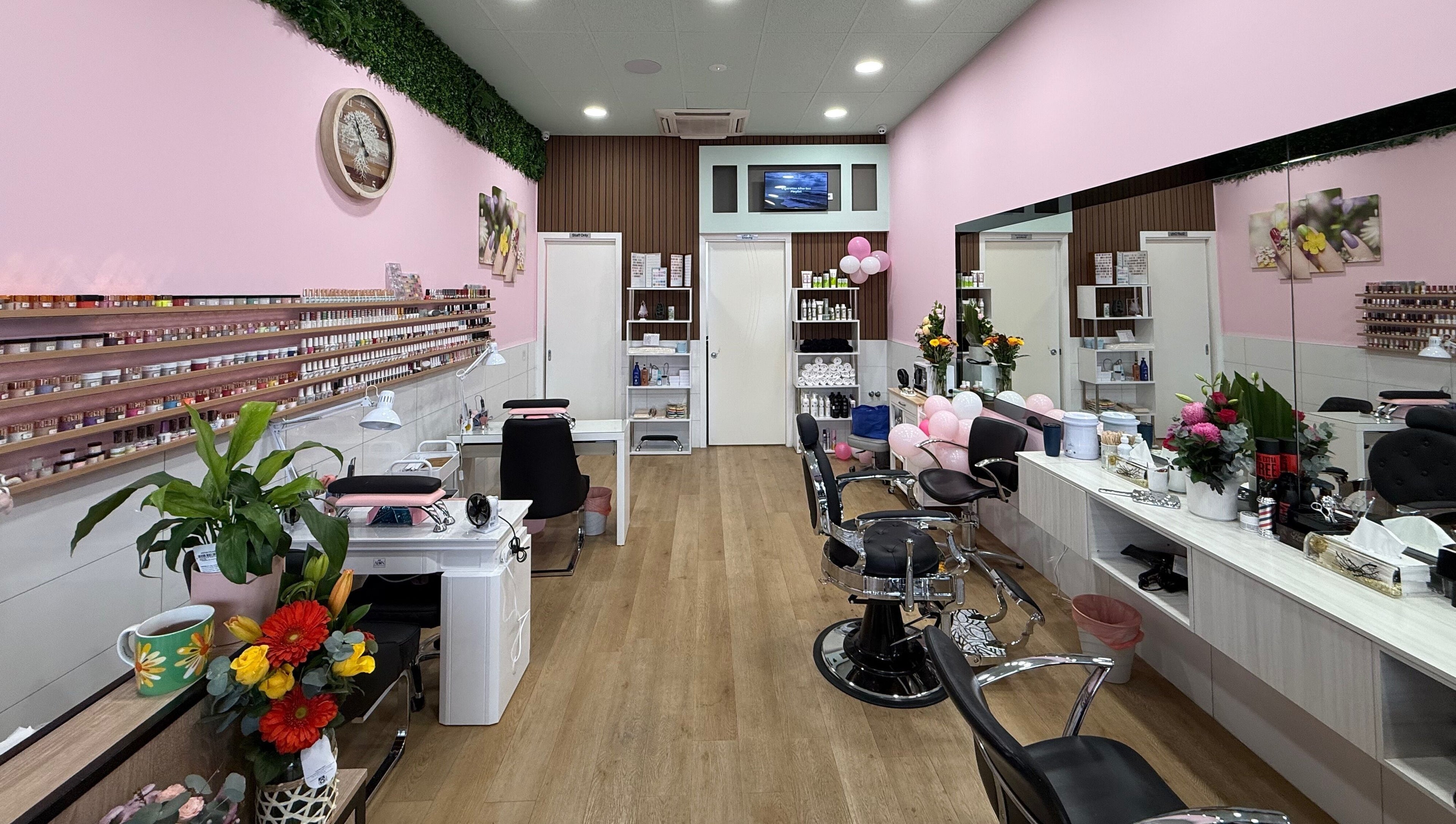 Interior of Master Cuts & Ca. with stylish decor in Melbourne, Victoria, AU, featuring chairs and beauty products.