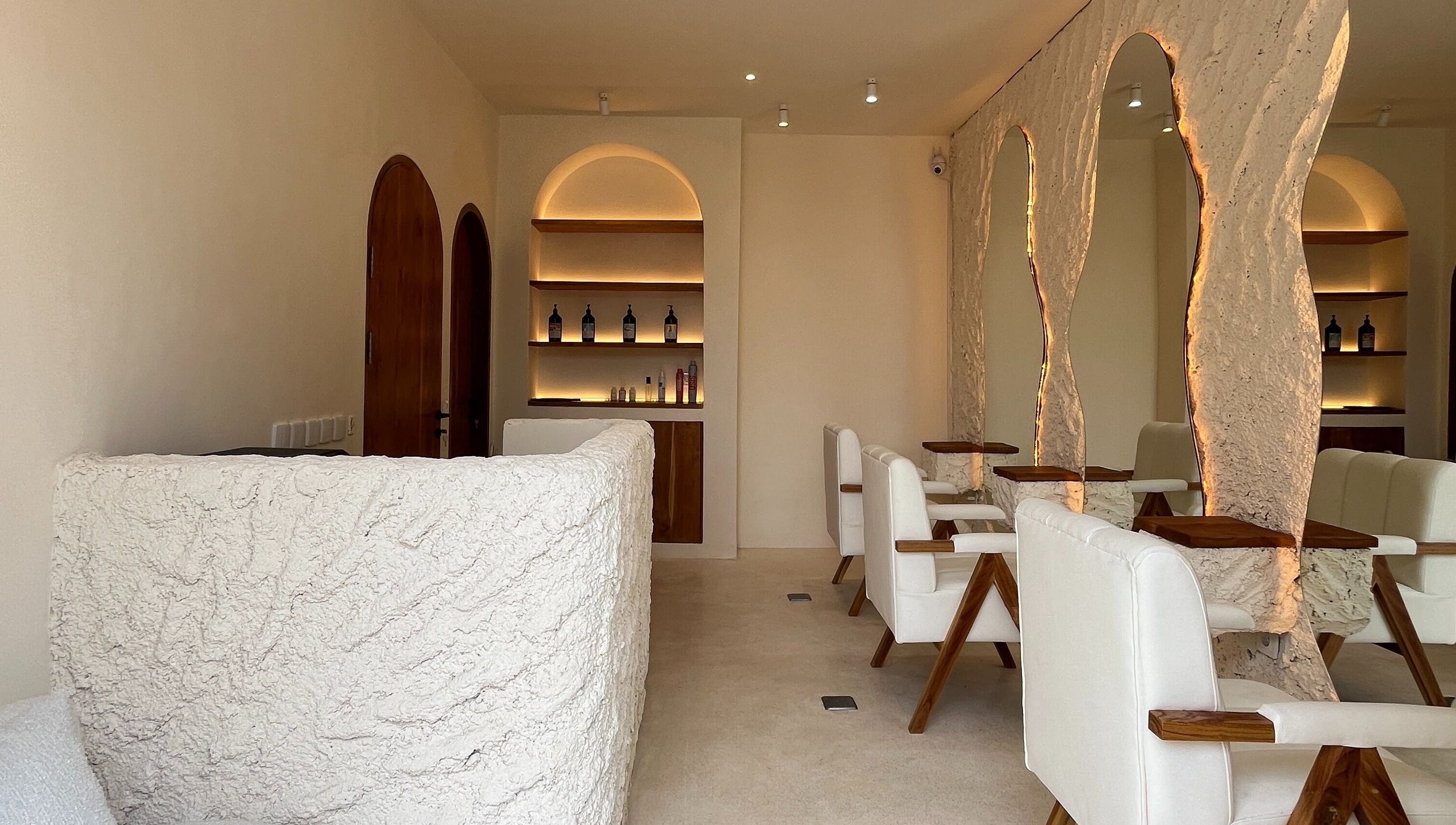 Elegant interior of The Pause Hair Salon and Head Spa, Bali, Bali, ID, with plush seating and soft lighting.