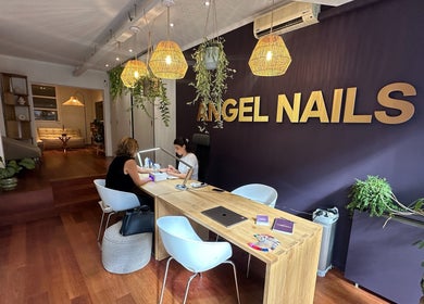 Cozy interior of Angel Nails, Uccle, Bruxelles, BE, featuring a manicure session and chic decor.