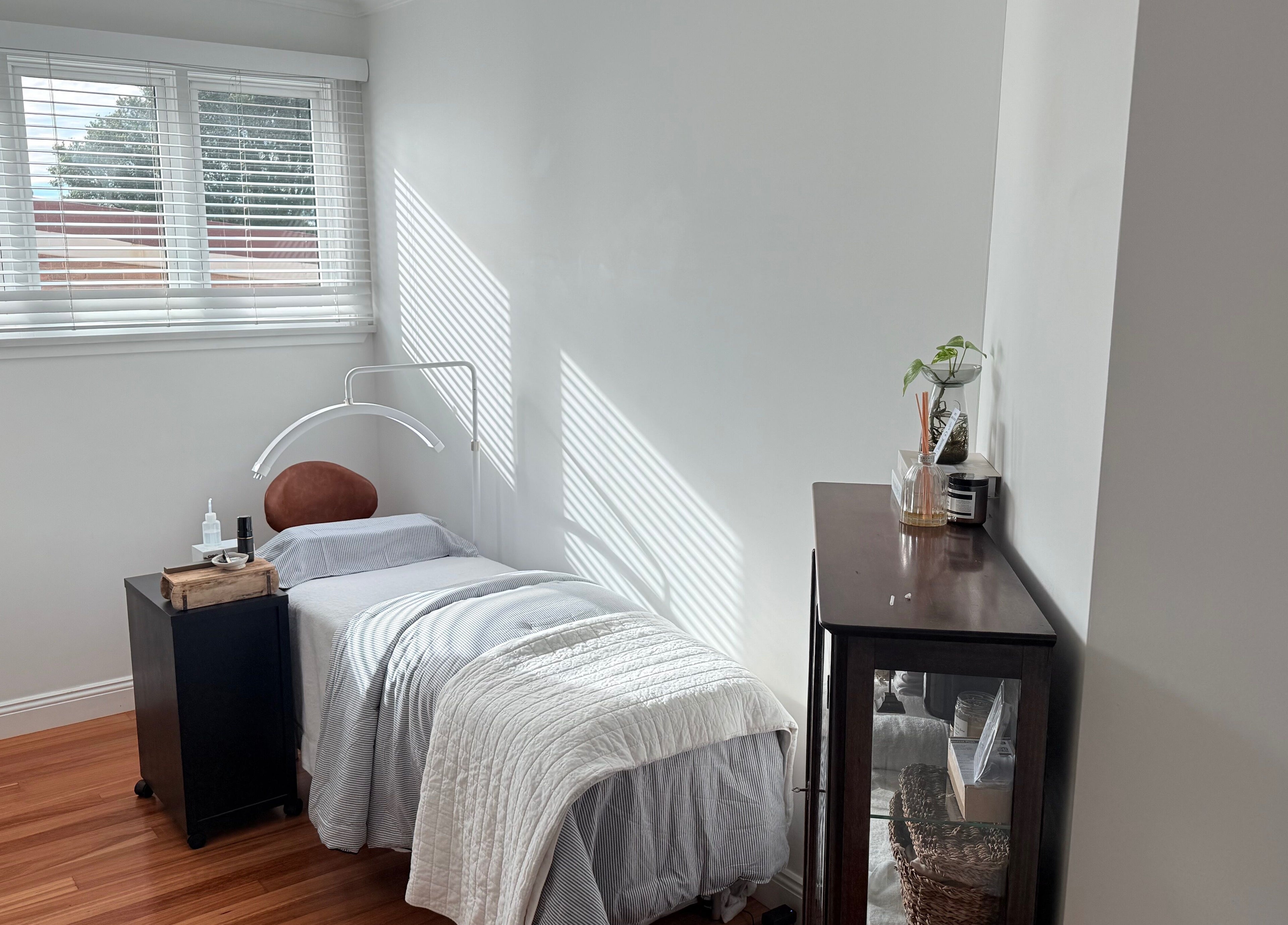 Relaxing treatment room at Ember Lash, Lilyfield, New South Wales, AU with a comfy bed and soothing decor.