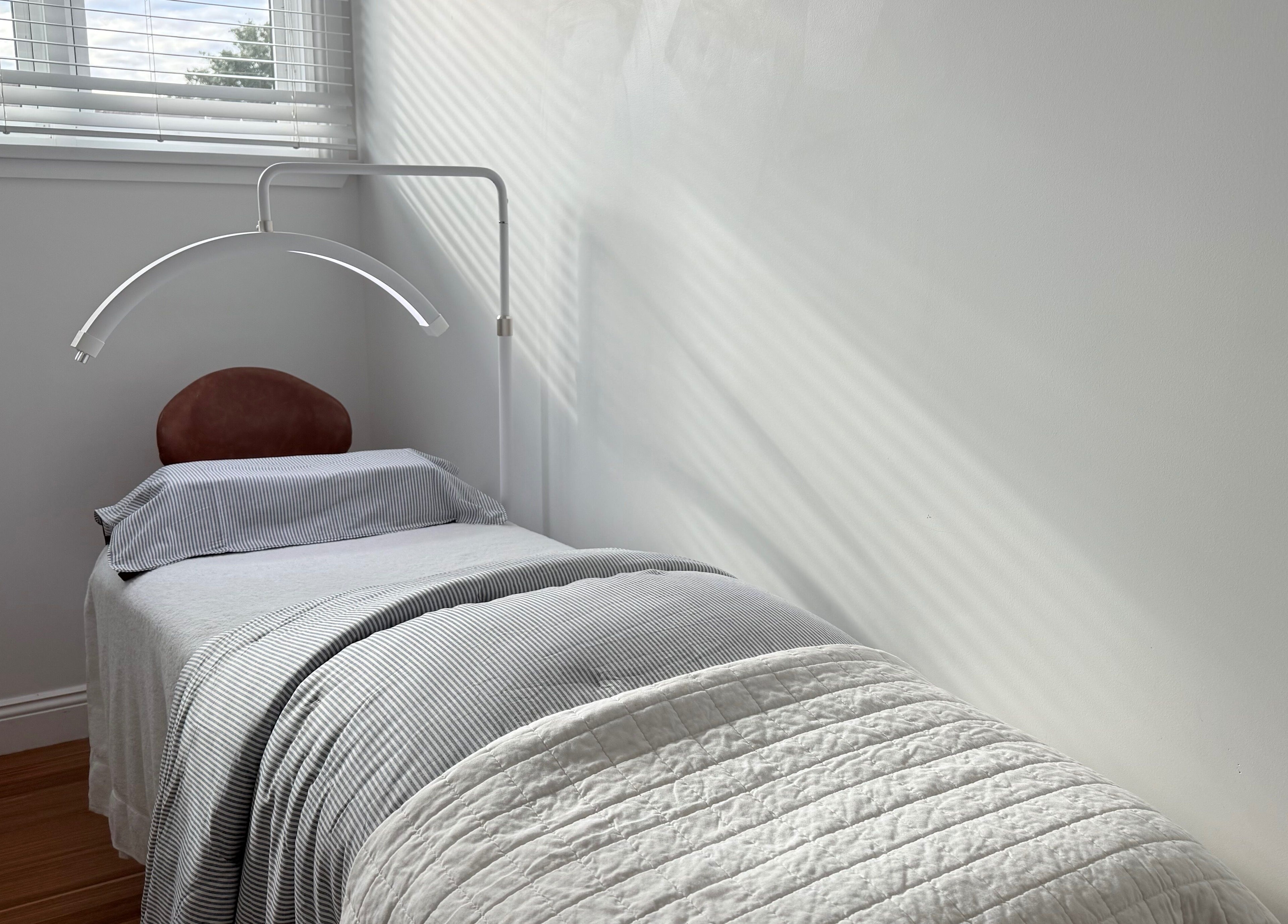 A serene treatment bed at Ember Lash in Lilyfield, New South Wales, AU, under soft natural light.