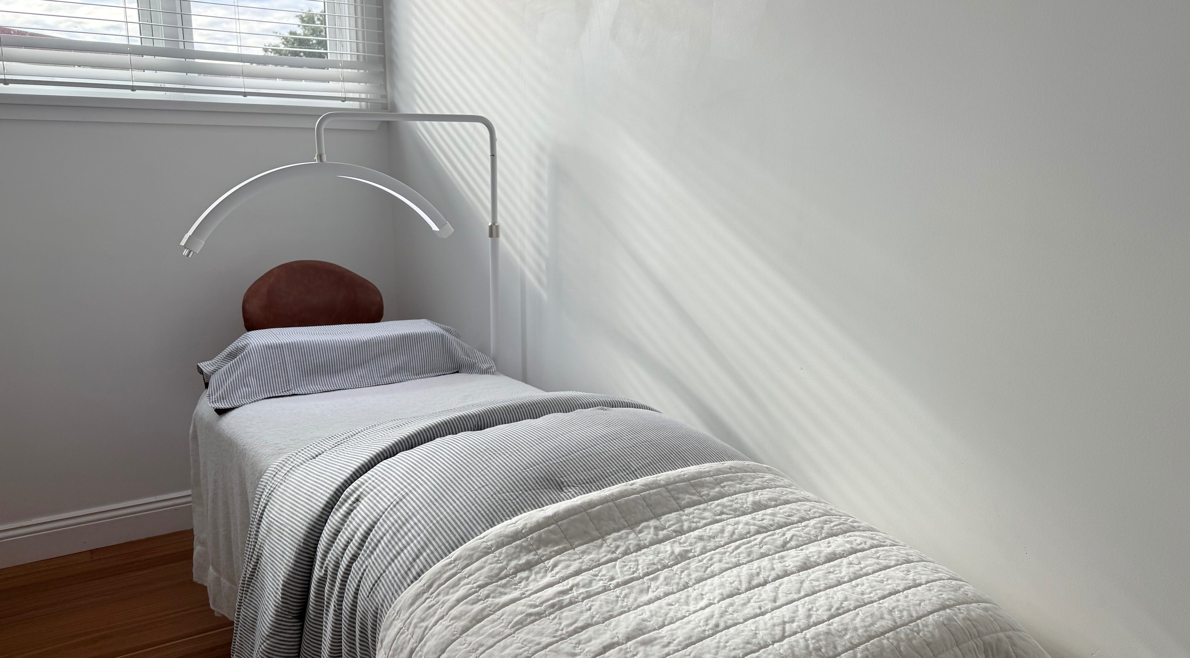 A serene treatment bed at Ember Lash in Lilyfield, New South Wales, AU, under soft natural light.