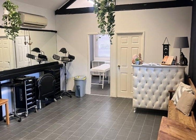 Stylish interior of Gloss&Glam Tamworth in Tamworth, England, GB with modern seating and elegant decor.