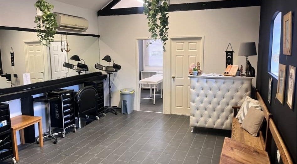 Stylish interior of Gloss&Glam Tamworth in Tamworth, England, GB with modern seating and elegant decor.