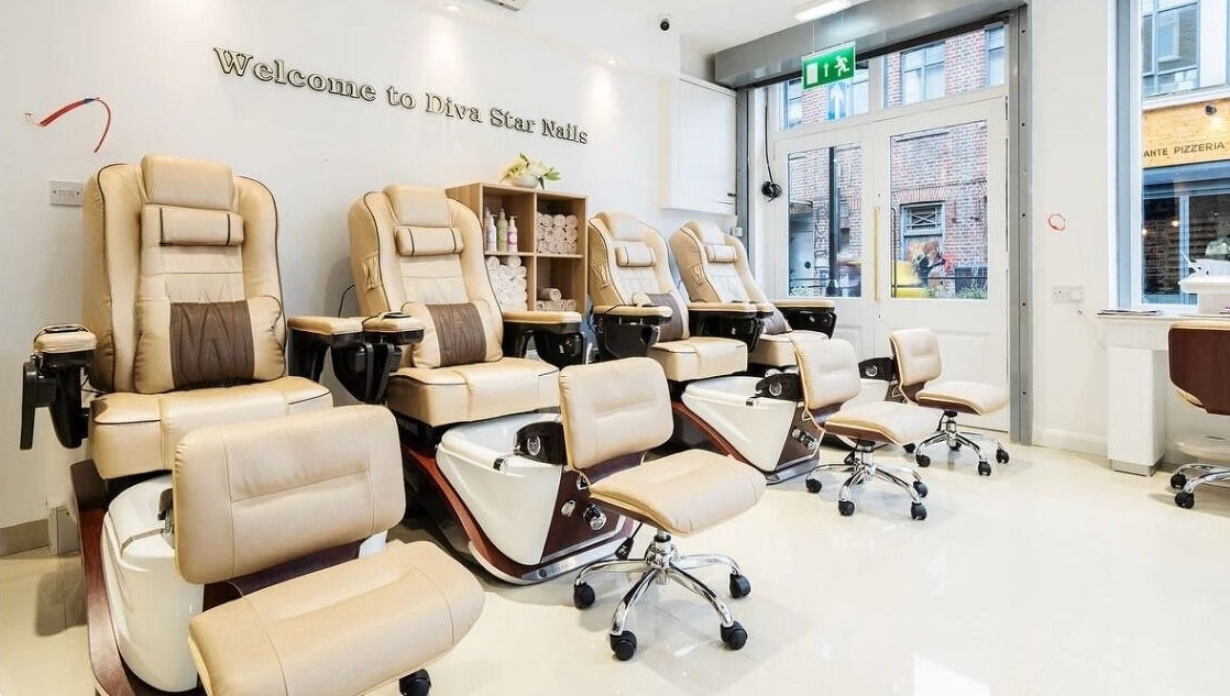 Luxurious nail salon chairs inside Diva Star Nails, London, England, GB, offering premium relaxation.