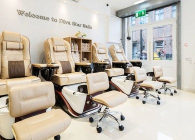 Luxurious nail salon chairs inside Diva Star Nails, London, England, GB, offering premium relaxation.