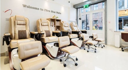 Luxurious nail salon chairs inside Diva Star Nails, London, England, GB, offering premium relaxation.