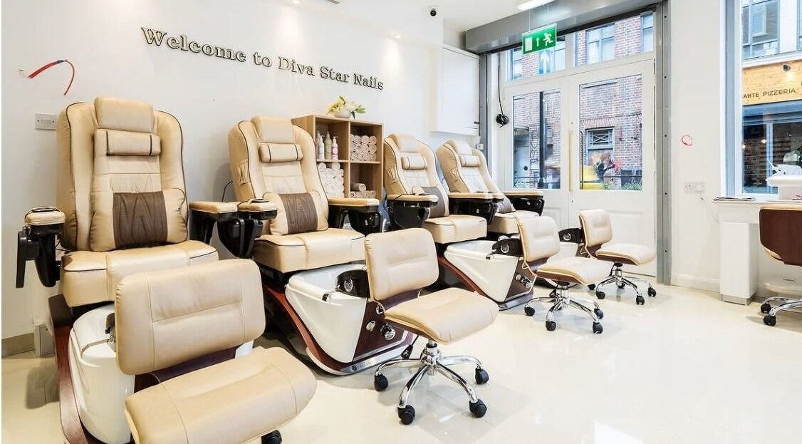 Luxurious nail salon chairs inside Diva Star Nails, London, England, GB, offering premium relaxation.