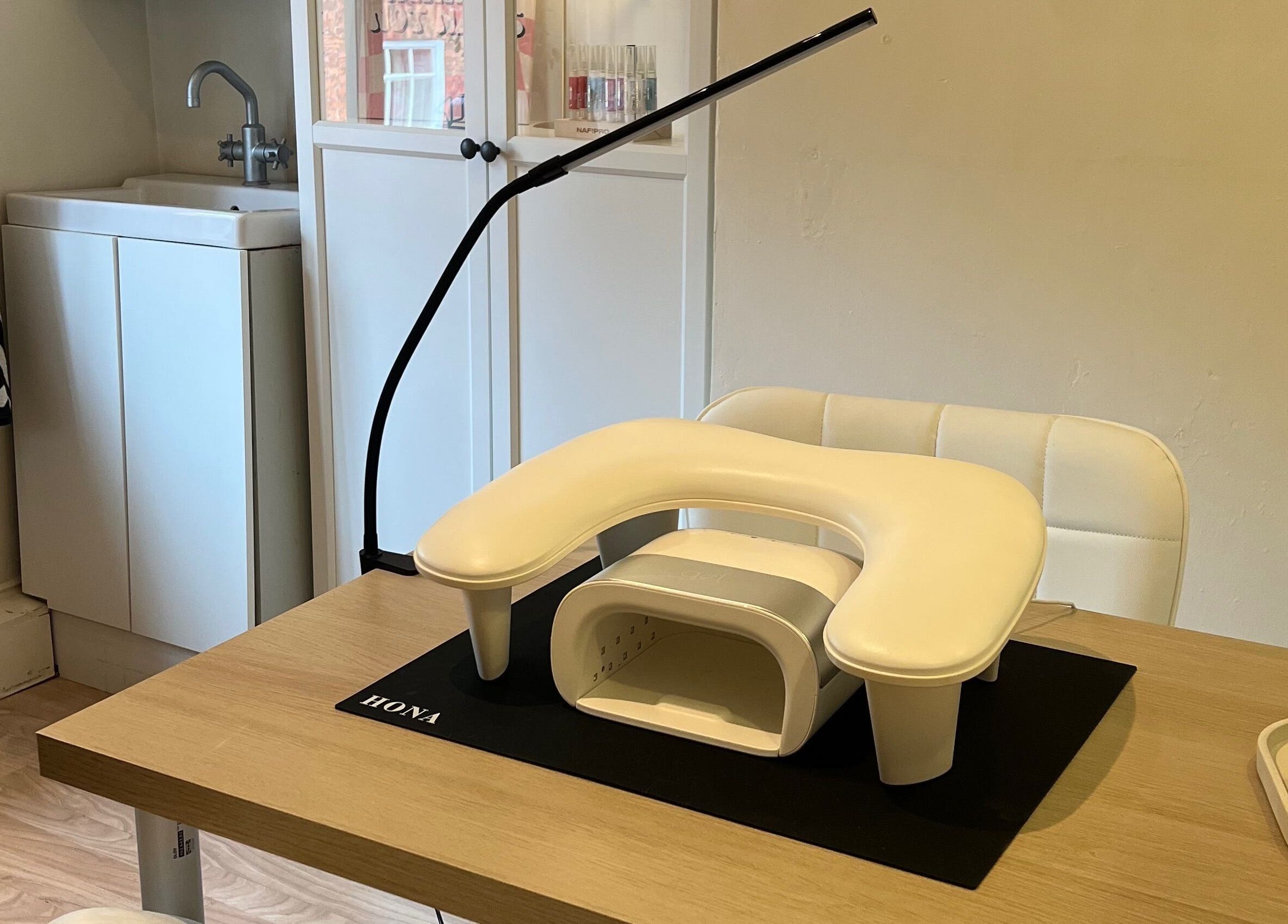 Nail station at Rosie's Retreat, Barton-under-needwood, England, GB, featuring manicure tools and equipment.