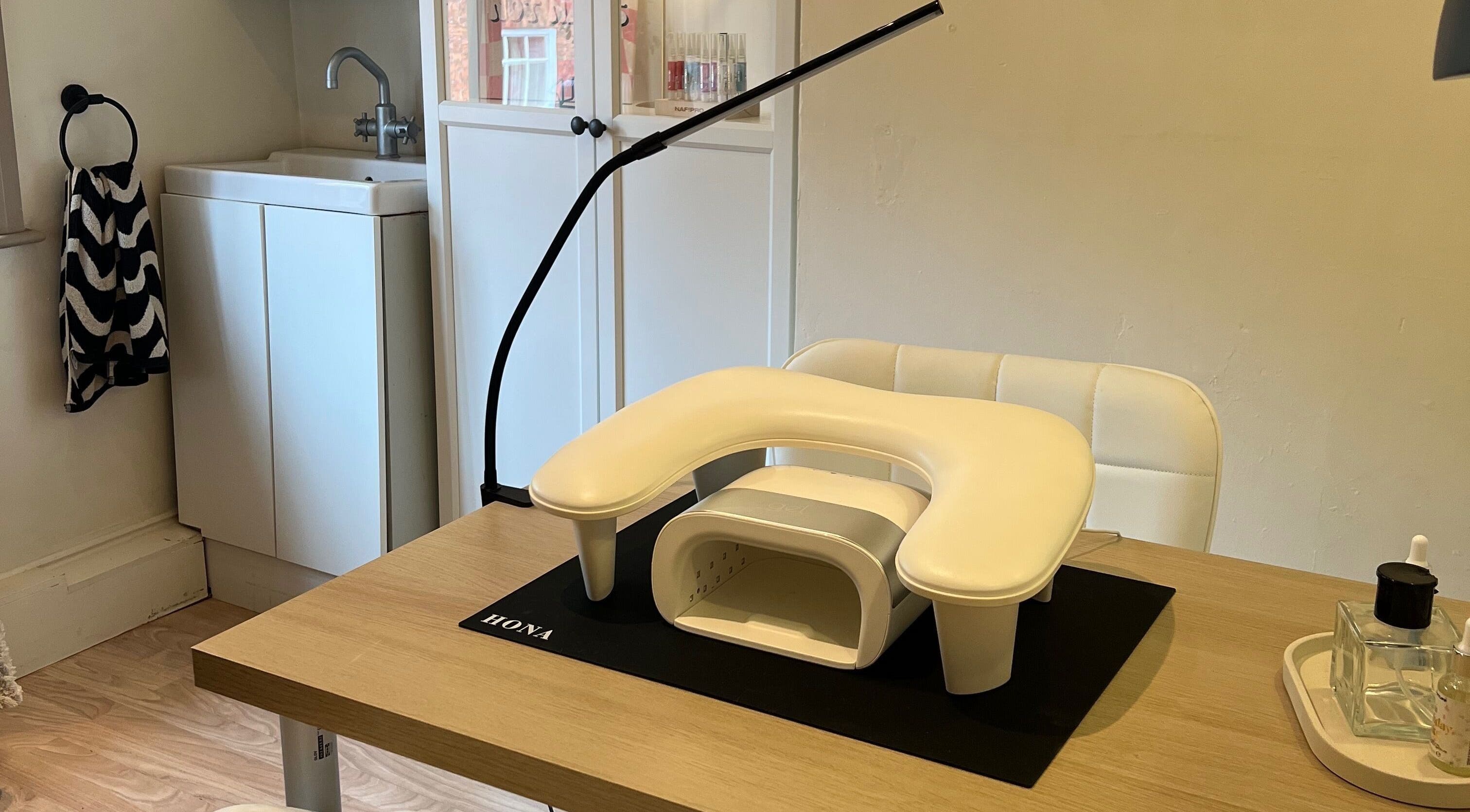 Nail station at Rosie's Retreat, Barton-under-needwood, England, GB, featuring manicure tools and equipment.