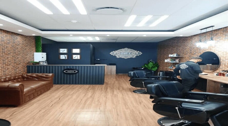 Elegant interior of Cut'z Barbershop Cornubia in Mount Edgecombe, Kwazulu-natal, ZA with leather seating.