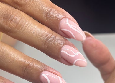 Intricate nail design at NAIL’D IT by khushi in Leicester, England, GB showcasing delicate white patterns.