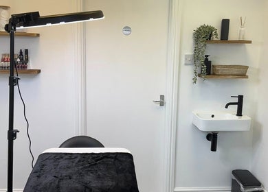 The Skiiin Nutritionist's serene treatment room in Bristol, England, GB, featuring modern decor and a sleek sink.