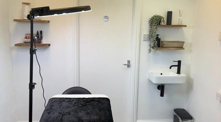 The Skiiin Nutritionist's serene treatment room in Bristol, England, GB, featuring modern decor and a sleek sink.