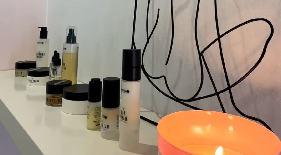 Stylish beauty products and a candle at Emma Beth Make-Up, Nerja, Andalucía, ES.