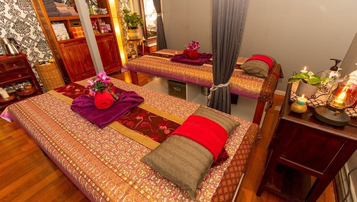 Cozy massage tables at Newtown Thai Massage, Enmore, New South Wales, AU, in a serene, warmly lit room.
