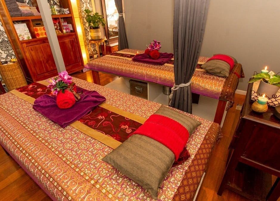 Cozy massage tables at Newtown Thai Massage, Enmore, New South Wales, AU, in a serene, warmly lit room.