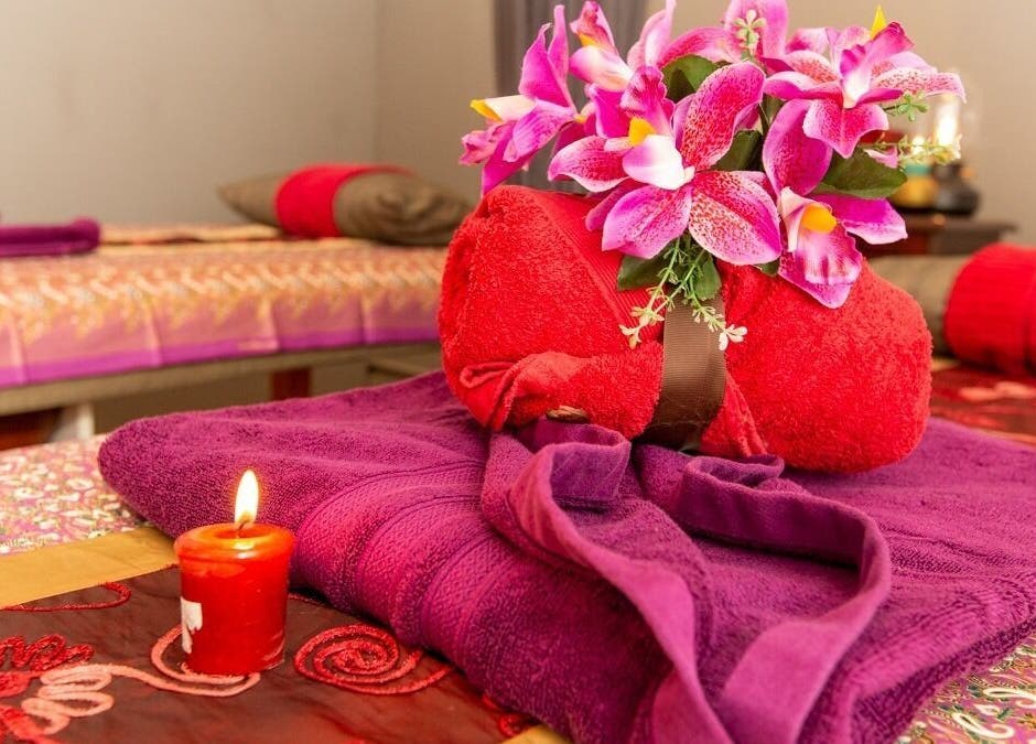 Relaxing massage setup with vibrant purple and red towels at Newtown Thai Massage, Enmore, New South Wales, AU.