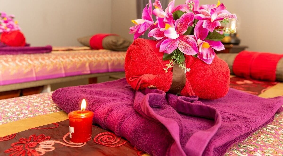 Relaxing massage setup with vibrant purple and red towels at Newtown Thai Massage, Enmore, New South Wales, AU.