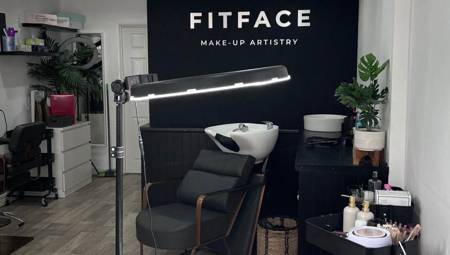 Elegant interior of Molly Freya Beauty in Royal Leamington Spa, England, showcasing sleek black salon furniture.