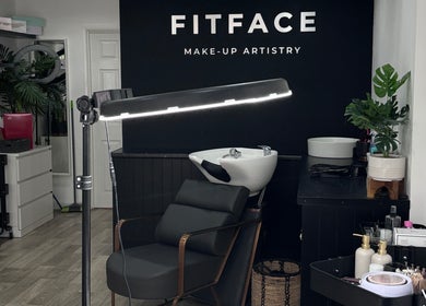 Elegant interior of Molly Freya Beauty in Royal Leamington Spa, England, showcasing sleek black salon furniture.