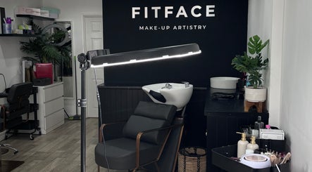 Elegant interior of Molly Freya Beauty in Royal Leamington Spa, England, showcasing sleek black salon furniture.