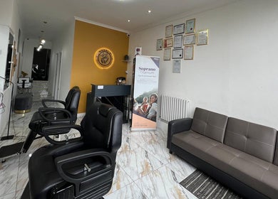 Modern interior of Noshi’s Beauty Hub & Academy in London, England, GB with stylish chairs and decor.