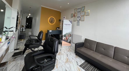 Modern interior of Noshi’s Beauty Hub & Academy in London, England, GB with stylish chairs and decor.