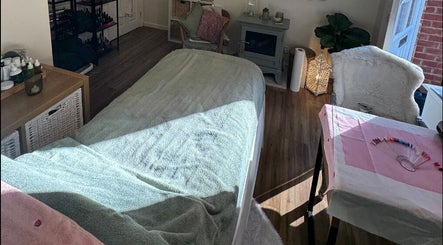 Cozy treatment room at Stripped Beauty, Basingstoke, England, GB, showcasing a tranquil spa setting.