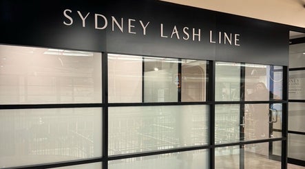 Entrance of Artistry By Angharad at Sydney Lash Line, Rosebery, New South Wales, AU showcasing elegant glass facade.