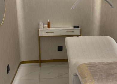 Cozy treatment room at Skin & sage, Cape Town, Western Cape, ZA with a luxurious bed and elegant decor.