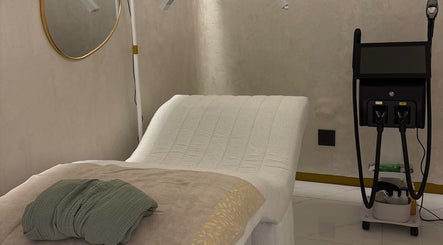 Luxurious treatment room at Skin & Sage in Cape Town, Western Cape, ZA with modern equipment and cozy bed.