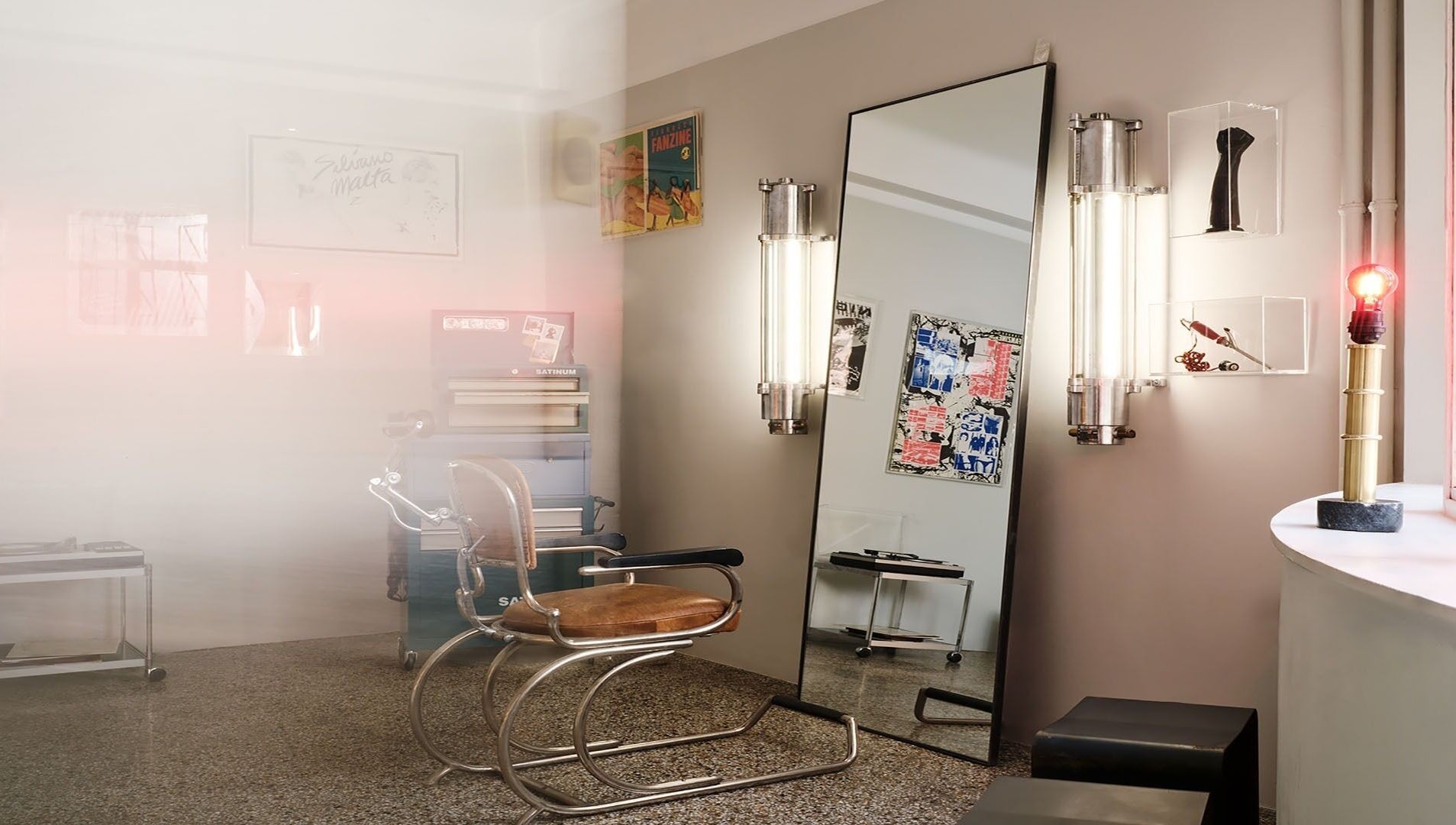 Stylish retro corner at Beletage Door Number 9, Athina, GR with a vintage salon chair and artistic decor.