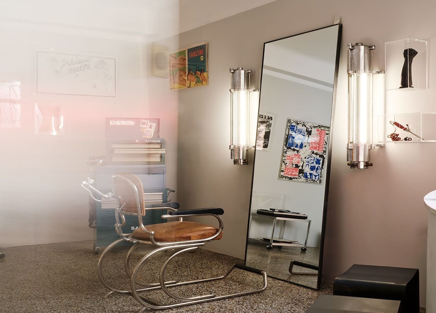 Stylish retro corner at Beletage Door Number 9, Athina, GR with a vintage salon chair and artistic decor.