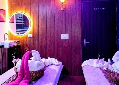 Relaxing spa room at Cora Spa in New Delhi, Delhi, IN with soft lighting and elegant decor.