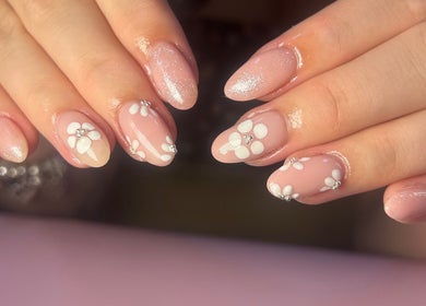 Elegant floral nail art at Nails by Maddy, Truro, England, GB.