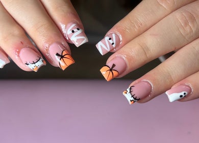 Halloween-themed nail art at Nails by Maddy, Truro, England, GB. Features ghosts and pumpkins.