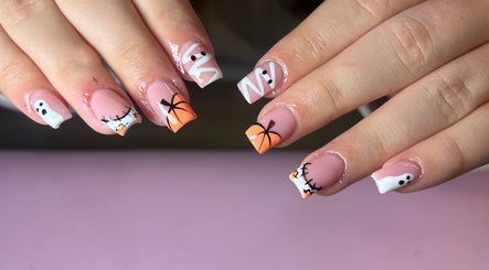 Halloween-themed nail art at Nails by Maddy, Truro, England, GB. Features ghosts and pumpkins.