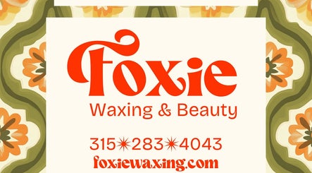 Foxie Waxing & Beauty logo with floral design, Auburn, New York, US.