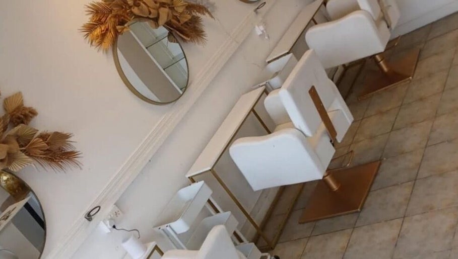 Elegant salon chairs and mirrors at Opal & Mane in Sunderland, England, GB.