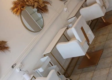 Elegant salon chairs and mirrors at Opal & Mane in Sunderland, England, GB.