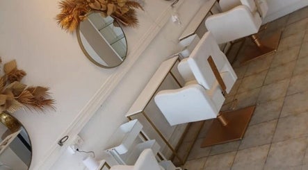 Elegant salon chairs and mirrors at Opal & Mane in Sunderland, England, GB.