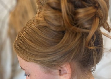 Elegant updo hairstyle at Opal & Mane in Sunderland, England, GB. Perfect for special occasions.