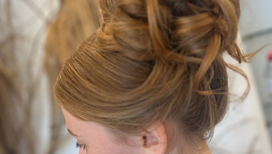 Elegant updo hairstyle at Opal & Mane in Sunderland, England, GB showcasing professional styling.