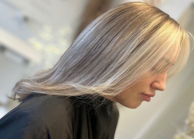 Sleek hairstyle at Opal & Mane in Sunderland, England, GB, showcasing glossy blonde hair.
