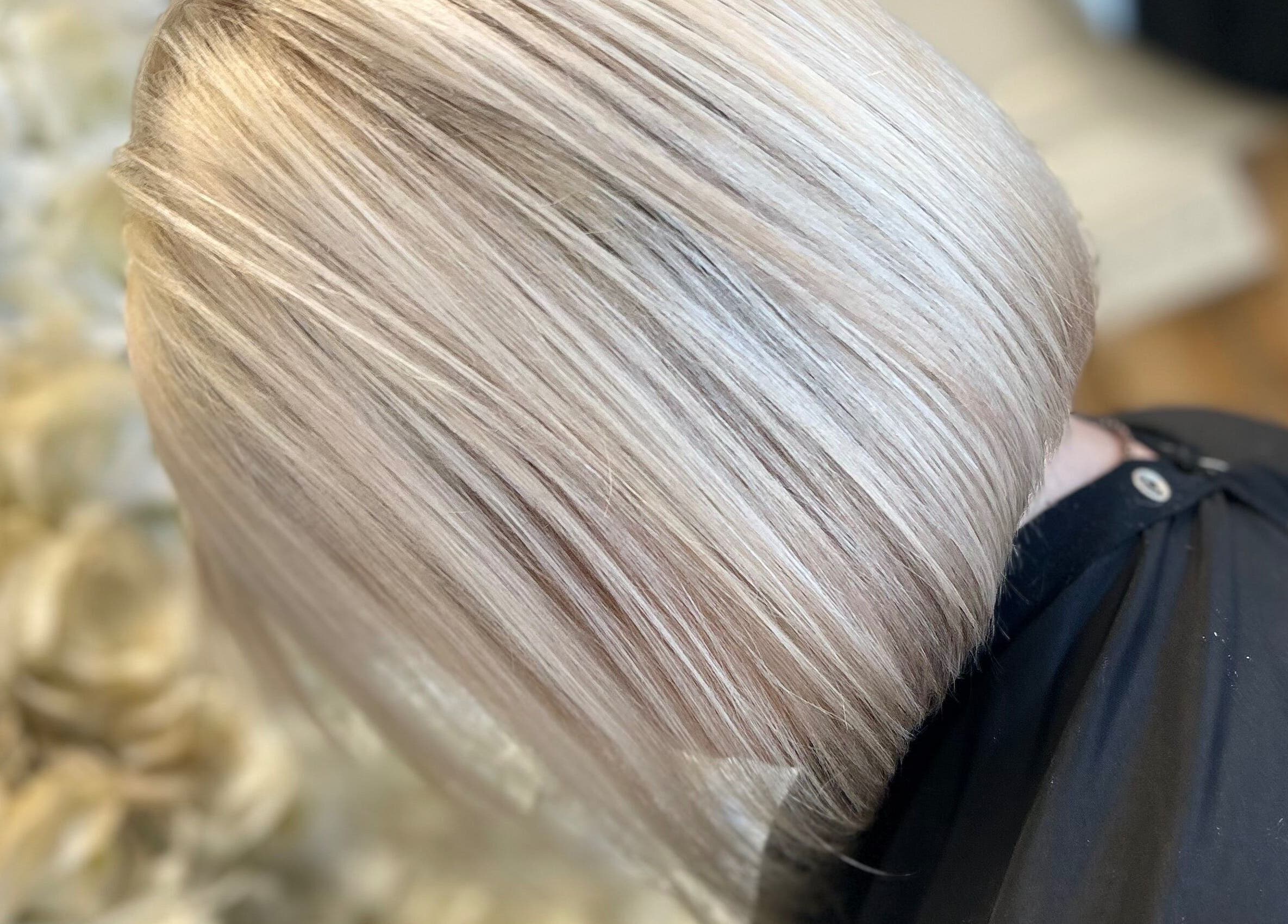 Close-up of a sleek blonde bob haircut at Opal & Mane, Sunderland, England, GB.