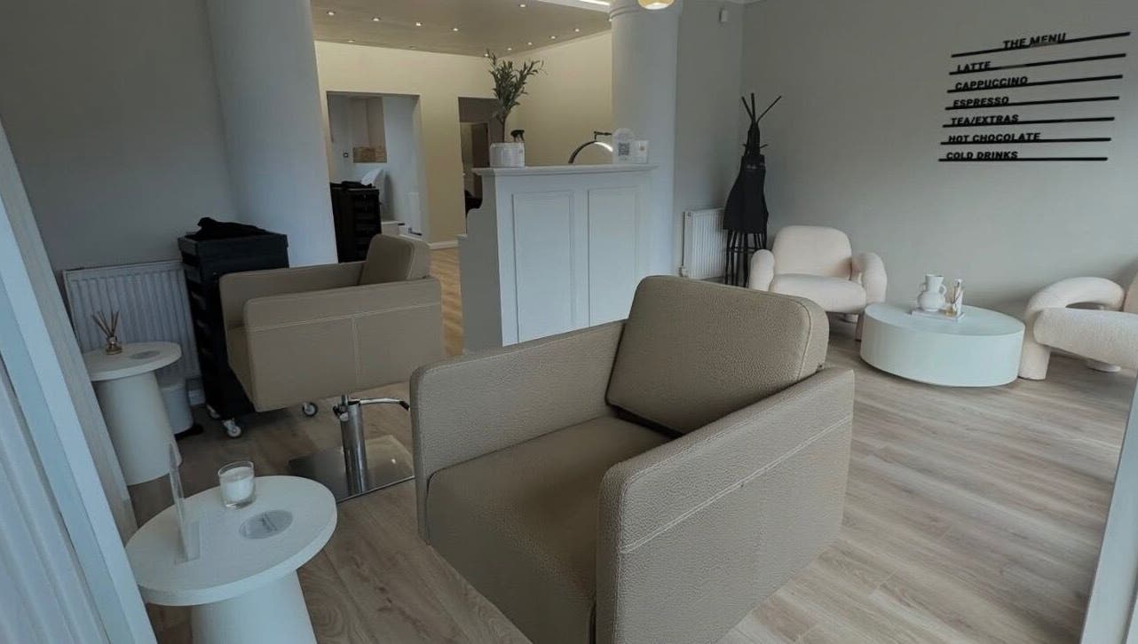 Elegant waiting area at Sadies Luxe Locks, Normanton, England, GB with modern chairs and decor.