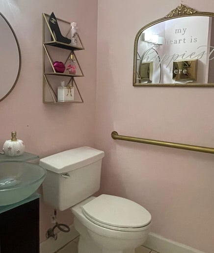 Elegant restroom at Exlat skin care suites, Hialeah, Florida, US with modern decor and stylish accents.