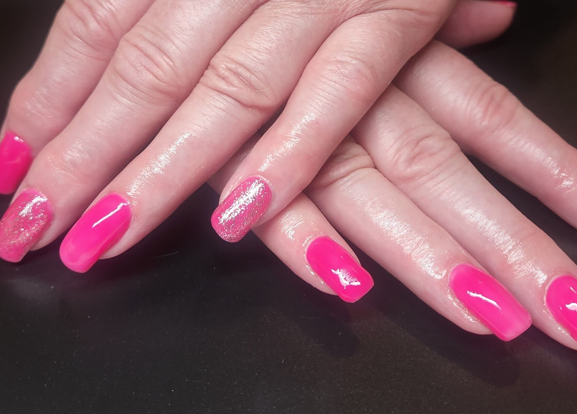 Bright pink nail art with glitter at Netty's Nail Studio, Pocatello, Idaho, US enhancing style.
